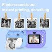 Children's photo printer with instant printing feature on a light blue background