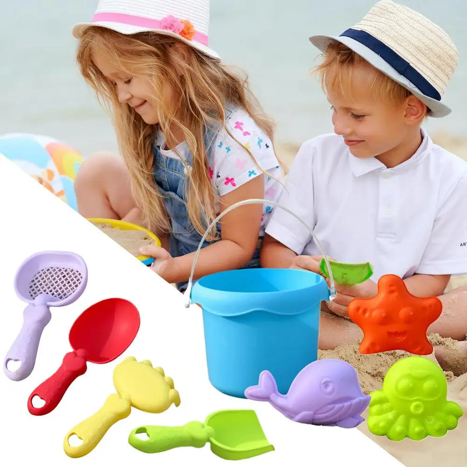 Children playing with colorful sand toys on a beach, including a bucket and various tools.