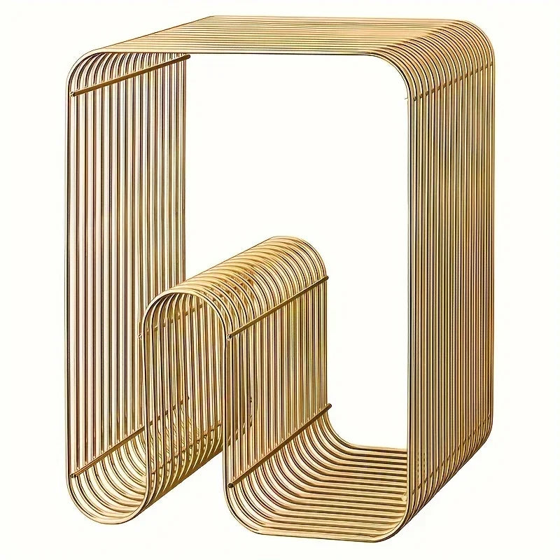 Gold metal side table with a modern design on a white background