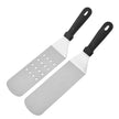 Two metal spatulas with black handles on a white background