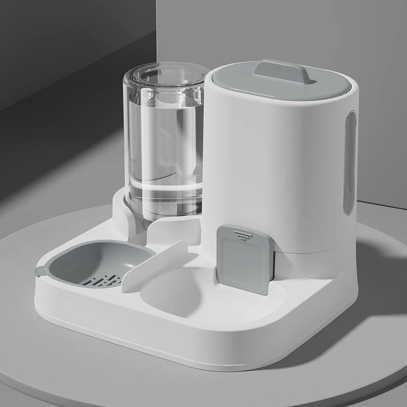 White pet feeder and water dispenser on a gray surface