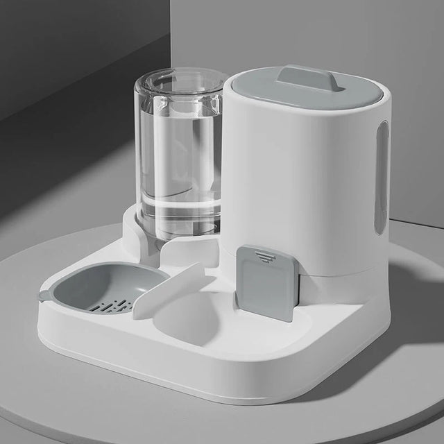 White pet feeder and water dispenser on a gray surface