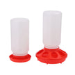 Two poultry feeders with red bases on a white background