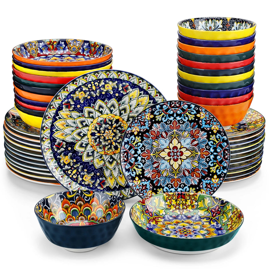 Colorful ceramic dinnerware set with intricate patterns on a white background