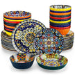 Colorful ceramic dinnerware set with intricate patterns on a white background