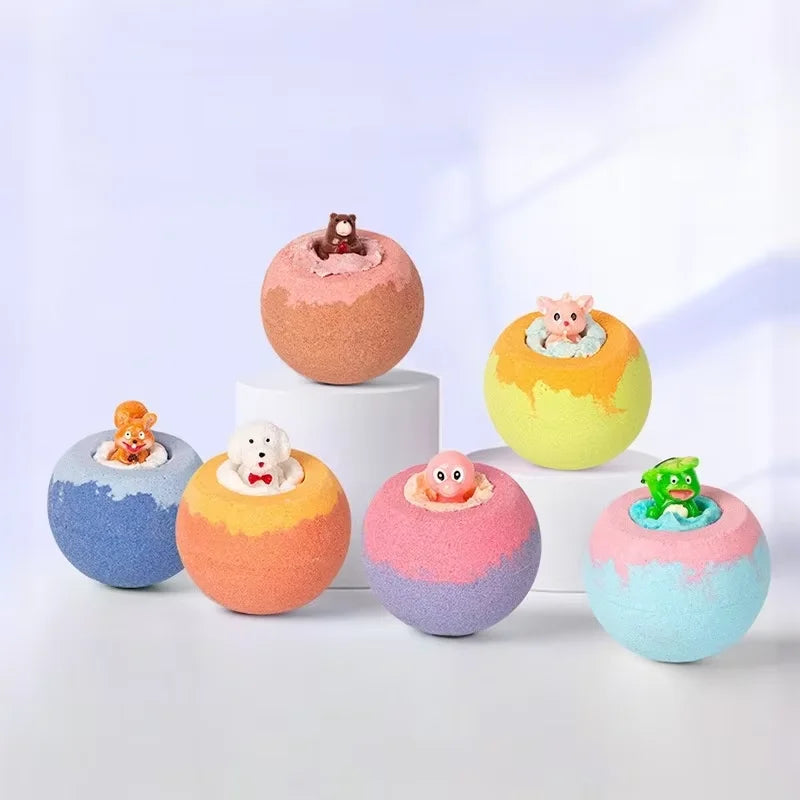 Colorful bath bombs with small figures on a light background