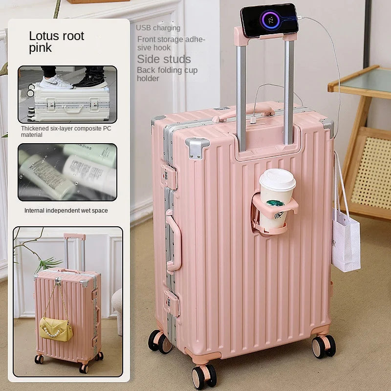 Pink suitcase with cup holder and charging port, next to product packaging.