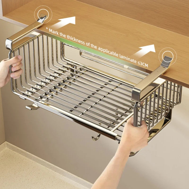 Metallic kitchen rack being installed under a wooden cabinet with hands holding it.