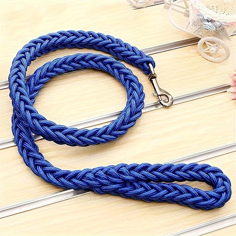 Blue braided dog leash on a wooden surface