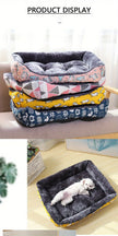 Stack of pet beds with geometric and animal patterns on a white surface.