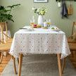 Dining table with a polka dot tablecloth in a home setting