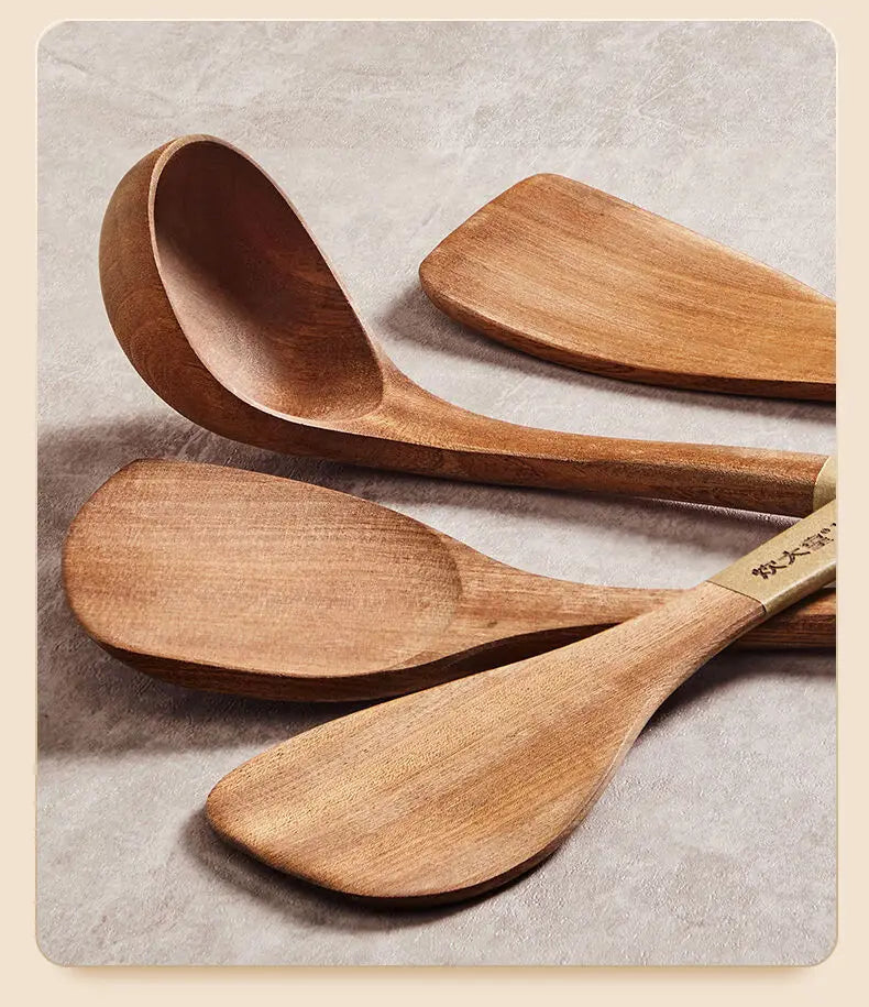 Set of wooden spoons on a textured surface
