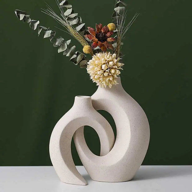 Decorative vase with floral arrangement on a dark green background
