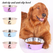 Dog with a pink anti-tip and anti-slip bowl, surrounded by other bowls on a white background.