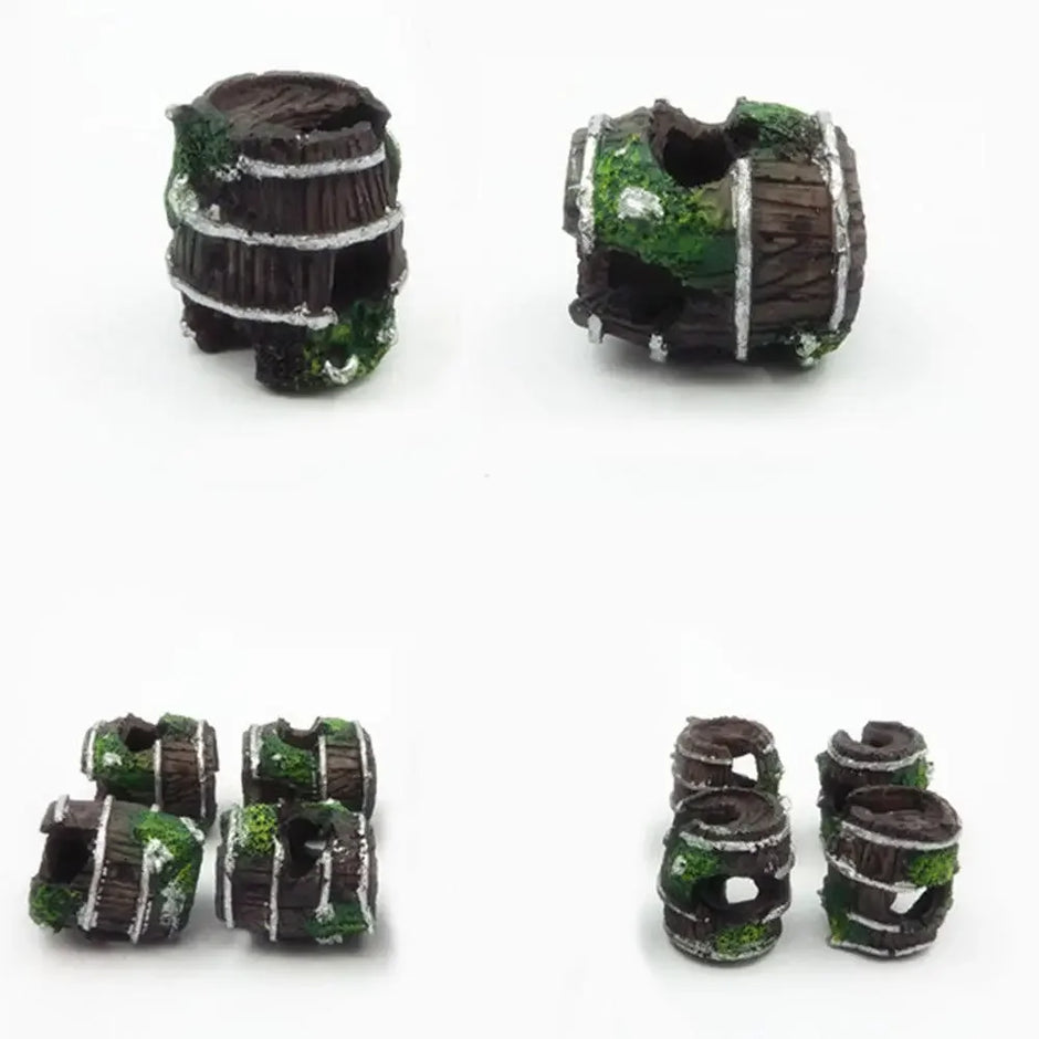 Set of miniature wargaming barrels with moss and rust effects on a white background