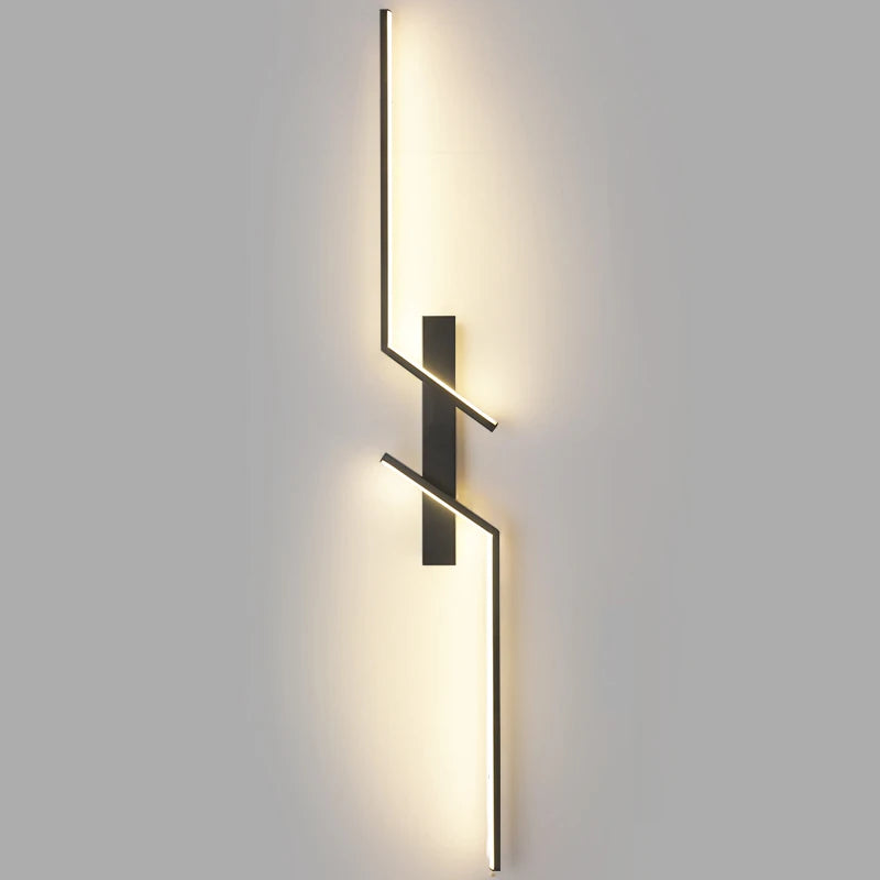Modern wall-mounted light fixture on a gray wall