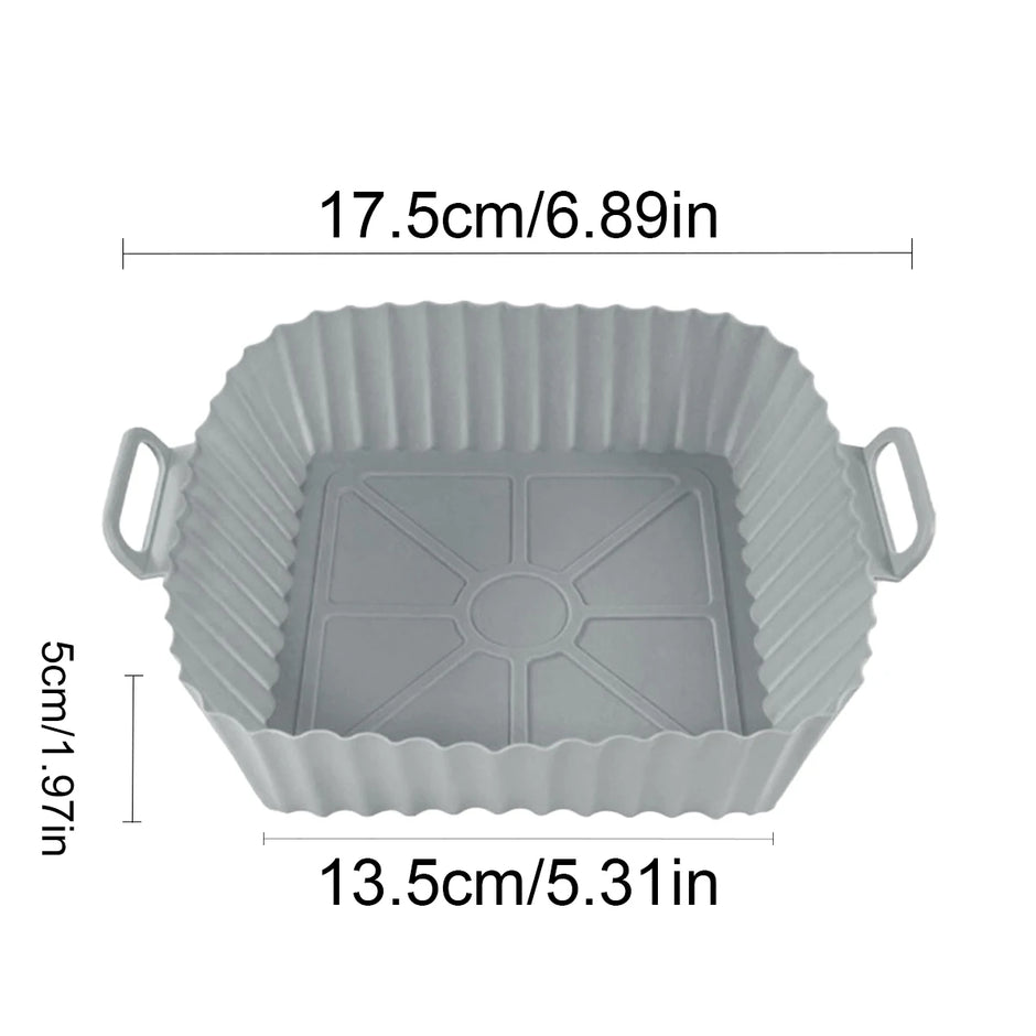 Gray silicone baking mold with dimensions indicated on a white background