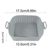 Gray silicone baking mold with dimensions indicated on a white background
