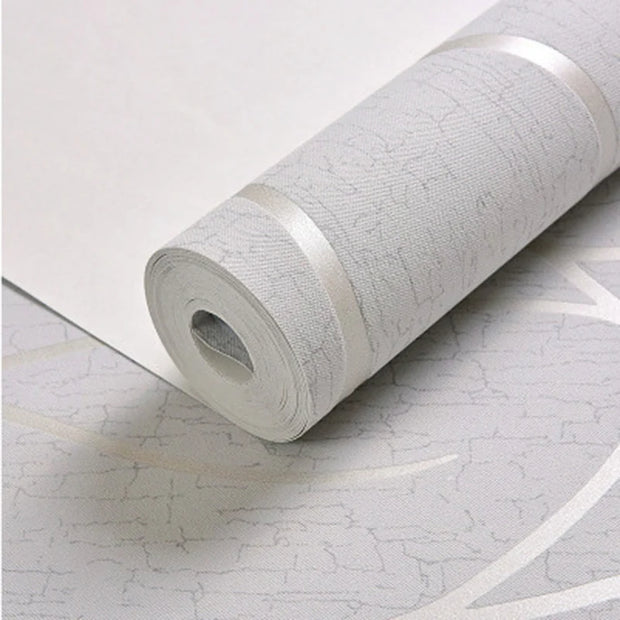 Roll of textured white wallpaper on a light gray surface