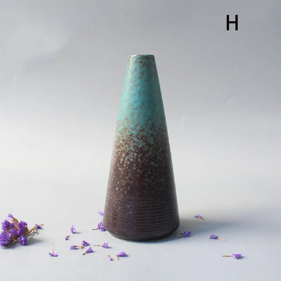Tapered ceramic vase with gradient finish on a light gray background