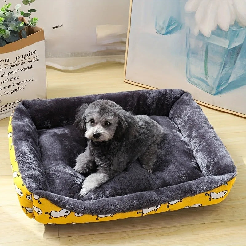 Dog lying on a gray pet bed with yellow border in a room setting.