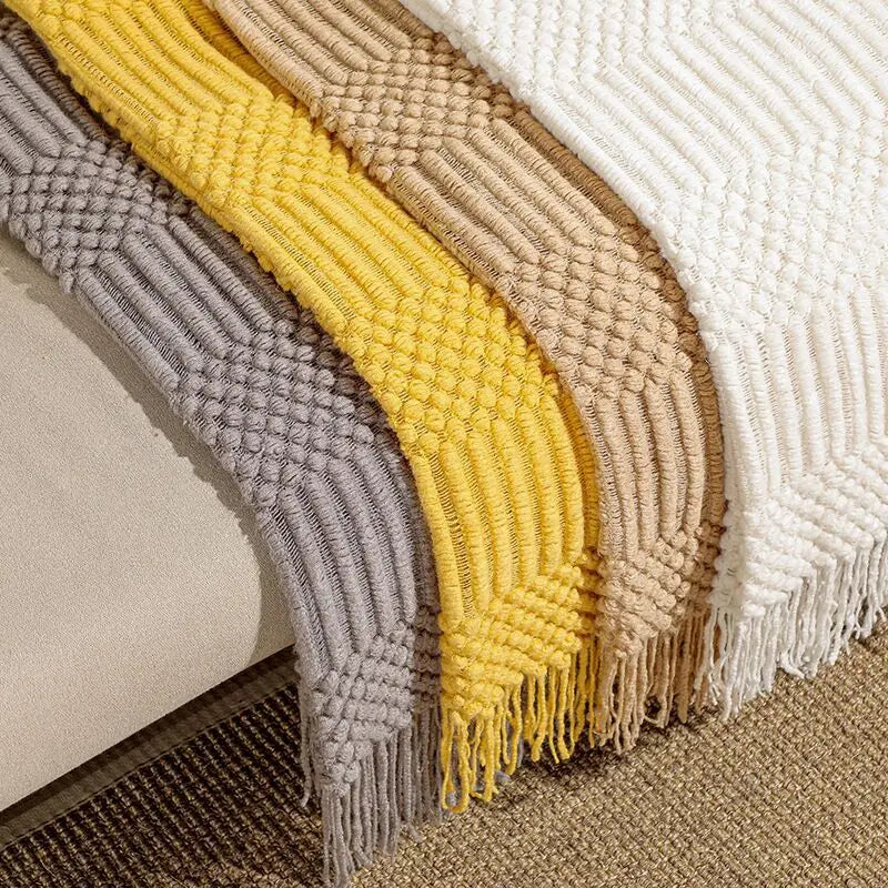 Set of woven area rugs in gray, yellow, beige, and white on a carpeted floor.