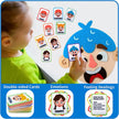 Child playing with emotional face cards and a large felt emotion mask.