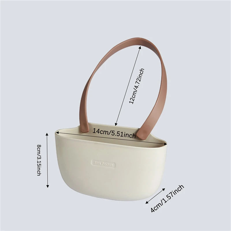 Beige handbag with brown handles and measurements on a light gray background