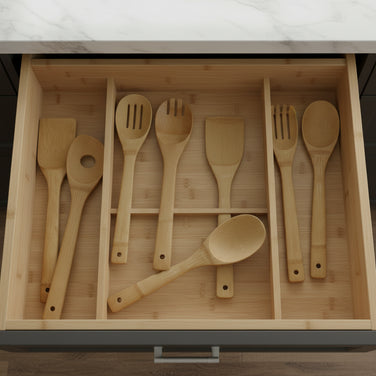Set of wooden kitchen utensils including spatulas and a fork on a white background