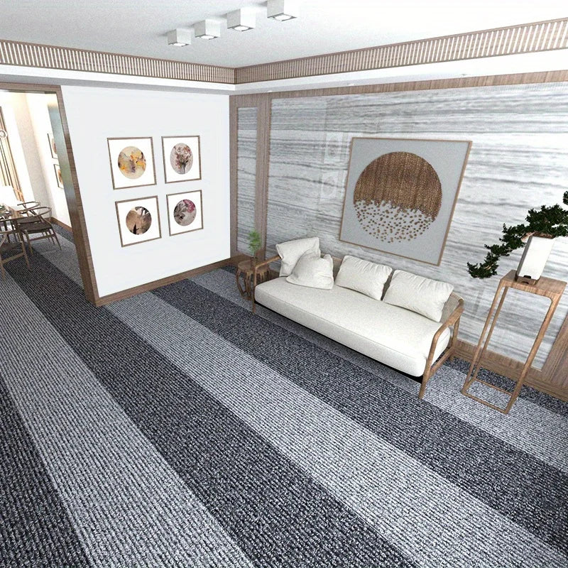 Modern living room with a white sofa, striped carpet, and decorative wall art.