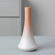 Gradient ceramic vase on a neutral background