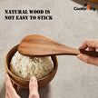 Wooden spoon lifting rice from a wooden bowl with text 'Natural wood is not easy to stick' and 'CookerKing' logo.