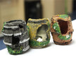 Three decorative aquarium rocks with natural textures and colors on a white surface.