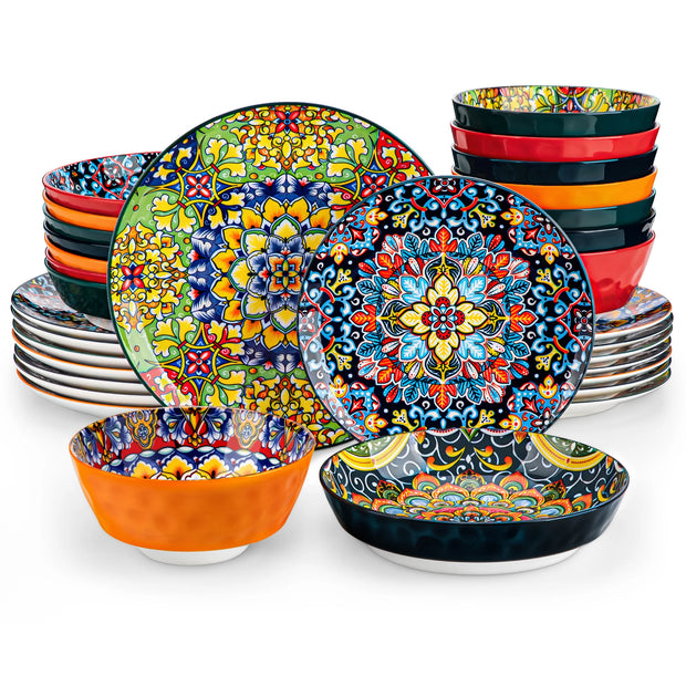 Set of colorful ceramic plates and bowls with intricate patterns on a white background
