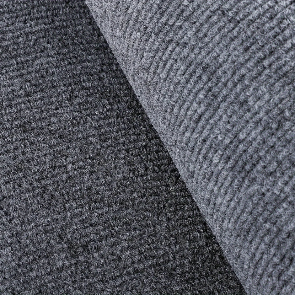 Close-up of textured gray carpet with a diagonal pattern