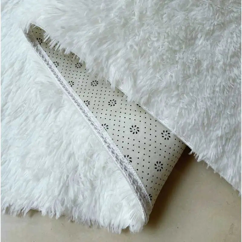 Close-up of white fluffy fabric with a patterned border