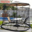 Outdoor patio set with mosquito netting around a table and chairs by a poolside.