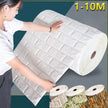 Person holding a large roll of white brick-patterned wallpaper with additional rolls displayed below.