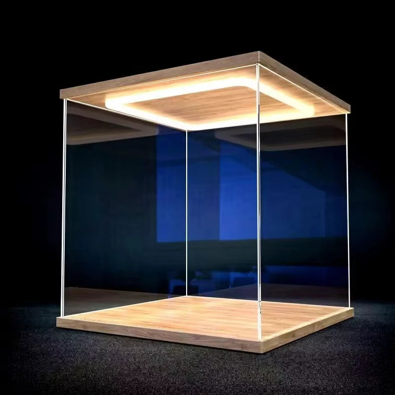 Modern glass display case with wooden base and top on a dark background