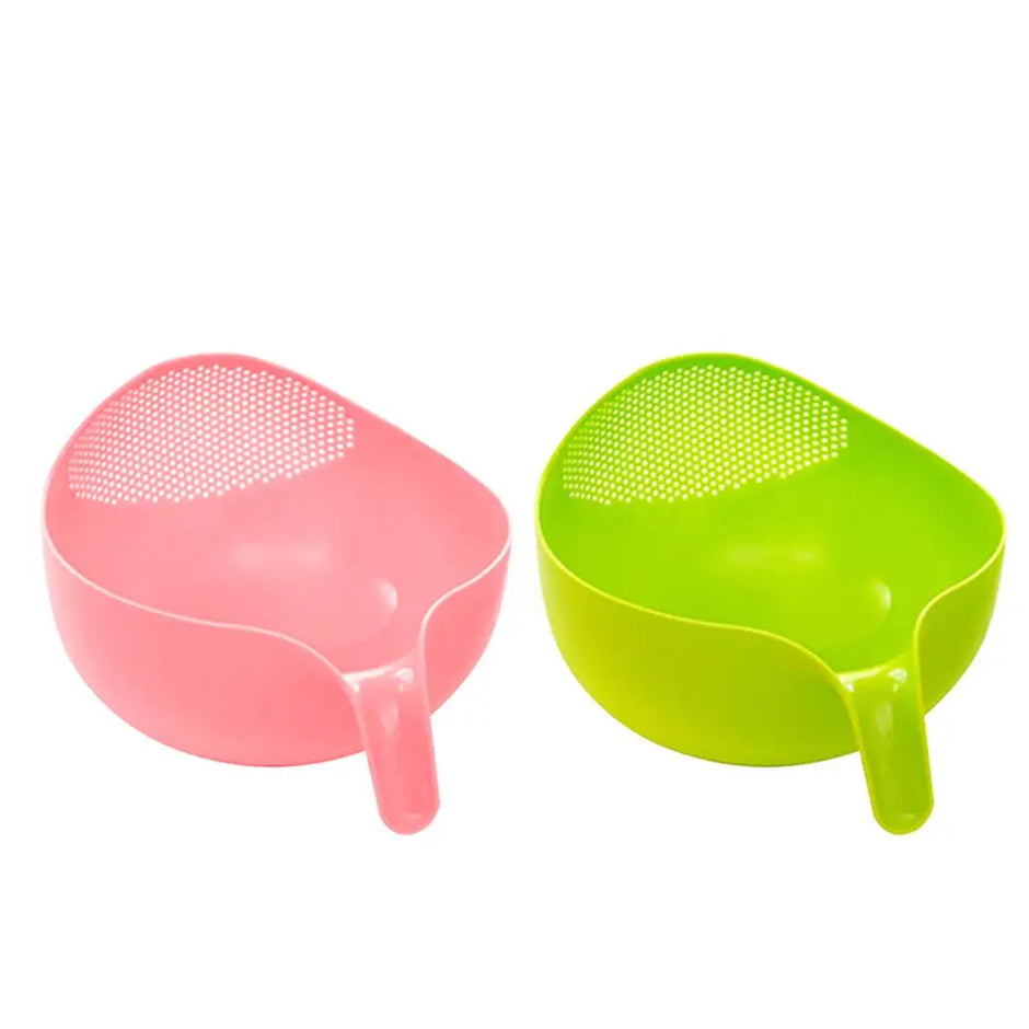 Pink and green kitchen tools on a white background