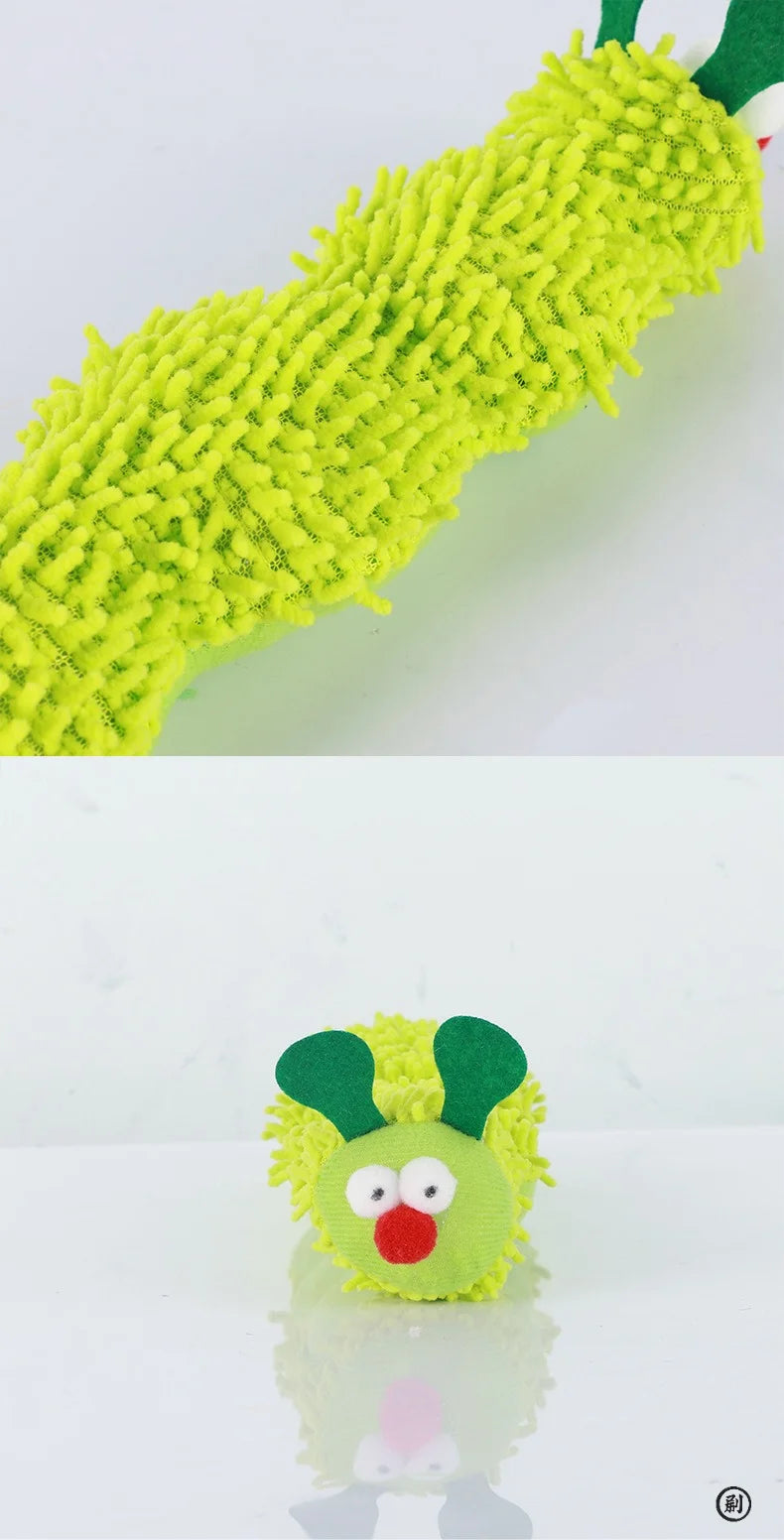 Green fuzzy caterpillar toy with a face on a white background