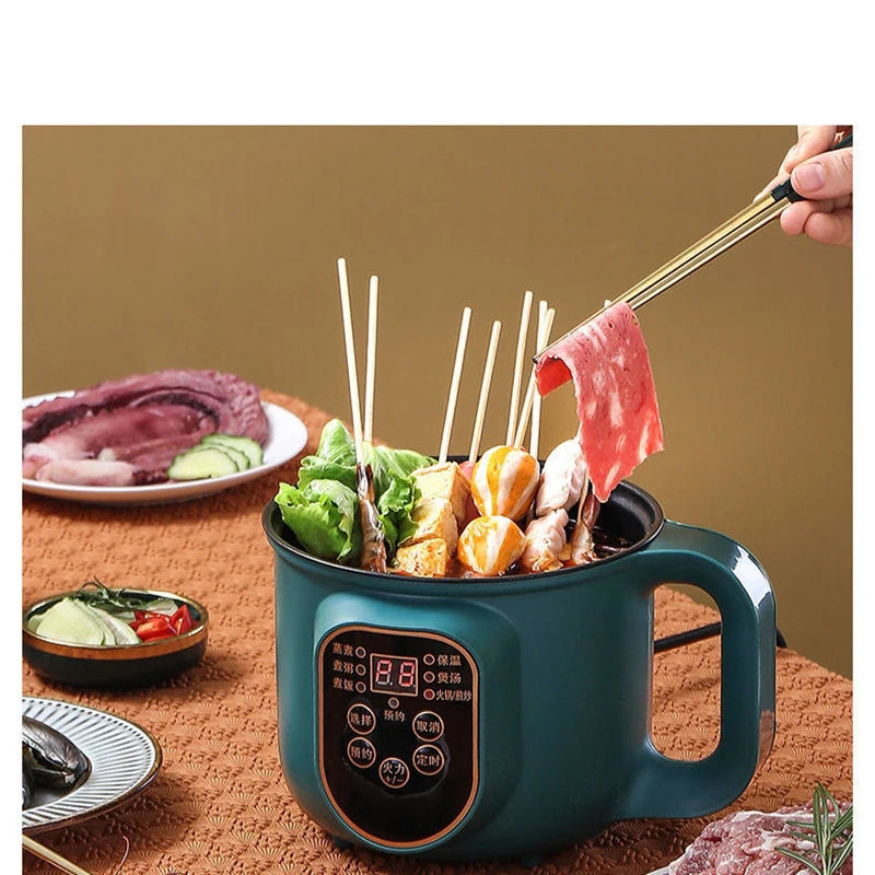 Teal electric hot pot with skewers of vegetables and meat on a wooden table.