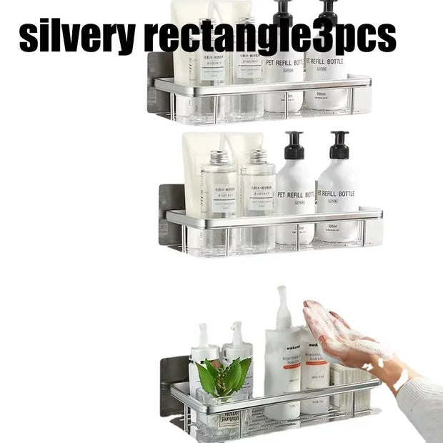 Silver rectangular wall-mounted organizer with bottles and a hand holding a soap dispenser.