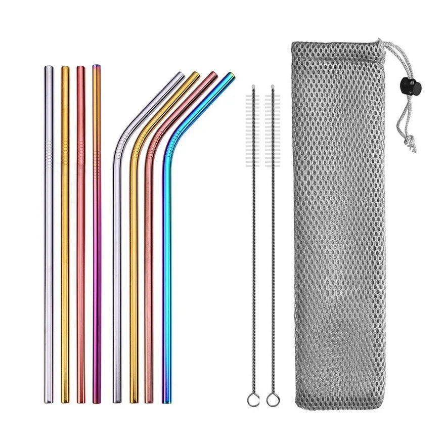 Set of colorful metal straws with cleaning brush and mesh pouch on a white background