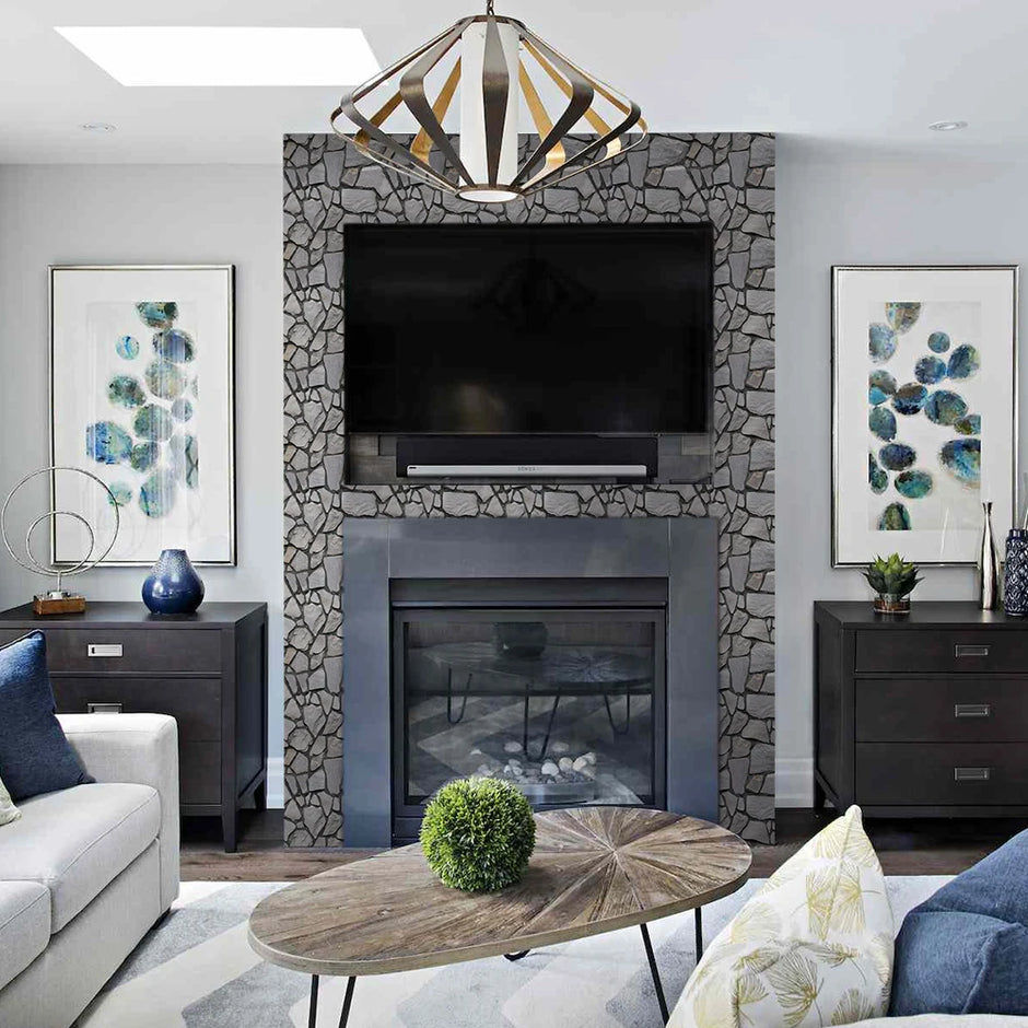 Modern living room with stone fireplace, television, and decorative elements.