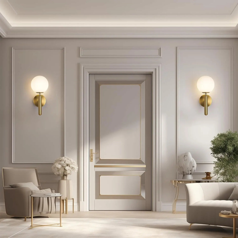 Modern interior design with a neutral color scheme, featuring a door, wall lights, and furniture.