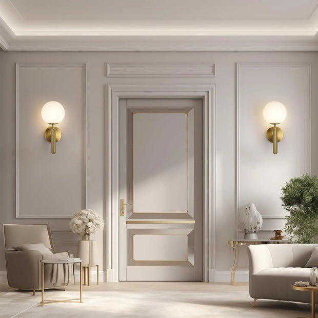 Modern interior design with a neutral color scheme, featuring a door, wall lights, and furniture.