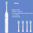 White electric toothbrush with four replacement heads on a blue background