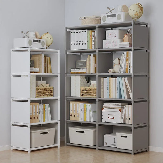 Two bookshelves with books, boxes, and decorative items against a plain wall.