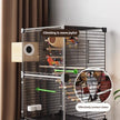Bird cage with perches and toys, featuring birds inside, on a neutral background.